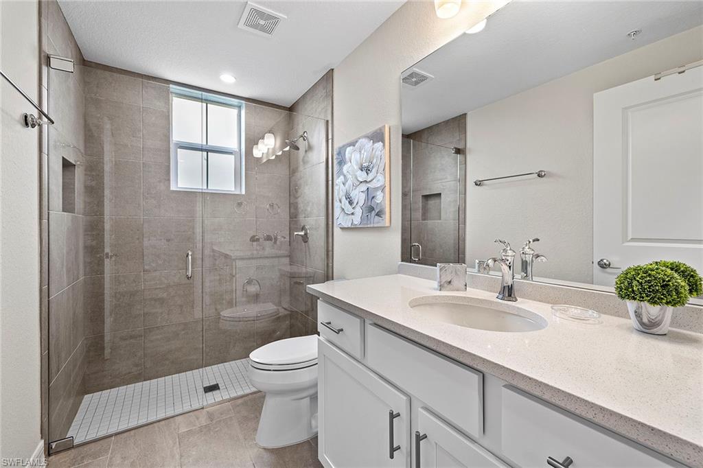 172 Indies Drive East, Unit 101 Naples, FL 34114 - Photo 18 of 33 Guest Bathroom