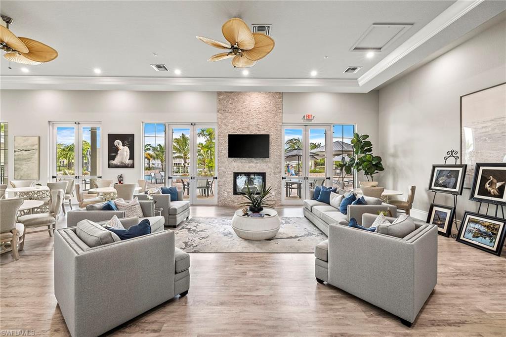 172 Indies Drive East, Unit 101 Naples, FL 34114 - Photo 27 of 33 Club House Sitting Area