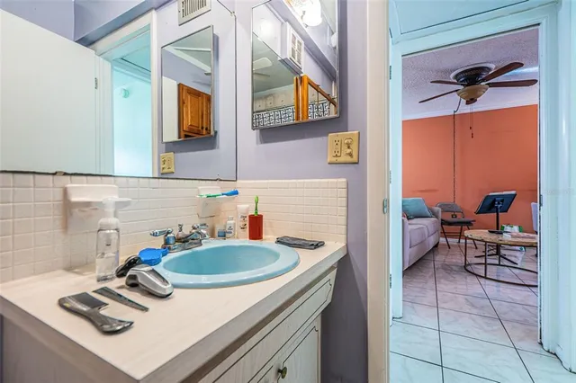 a kitchen with a sink appliances and cabinets