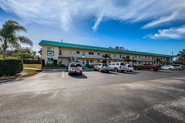 a car parked in front of a parking area