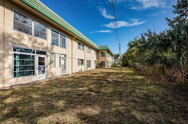 a view of house with yard