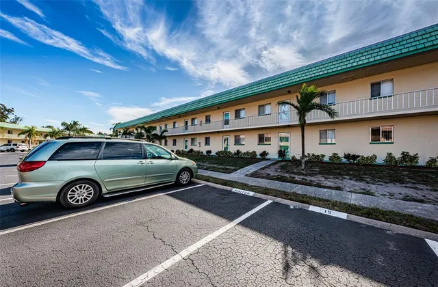 a front view of a house with parking area