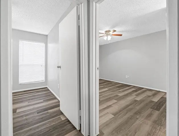 a view of an entryway with wooden floor