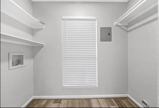 a view of a room that has a window in it