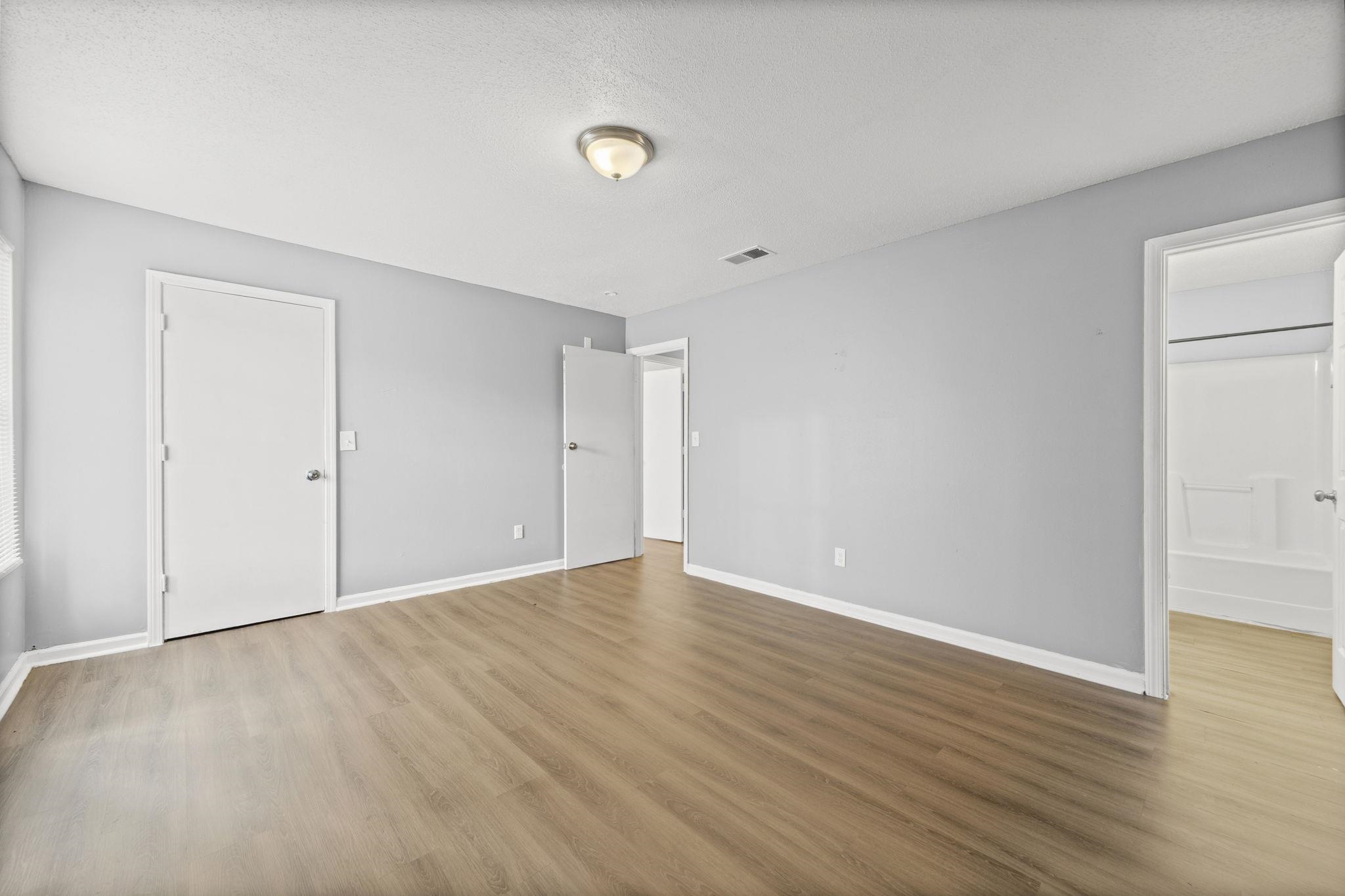 3480 Tallyho Road Memphis, TN 38128 - Photo 16 of 20 a view of an empty room with wooden floor