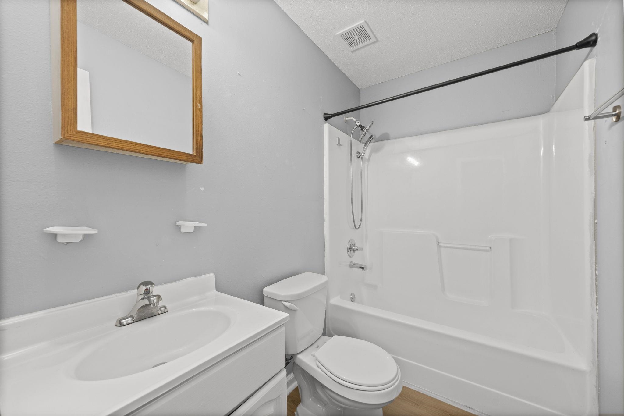 3480 Tallyho Road Memphis, TN 38128 - Photo 17 of 20 a bathroom with a sink toilet and shower