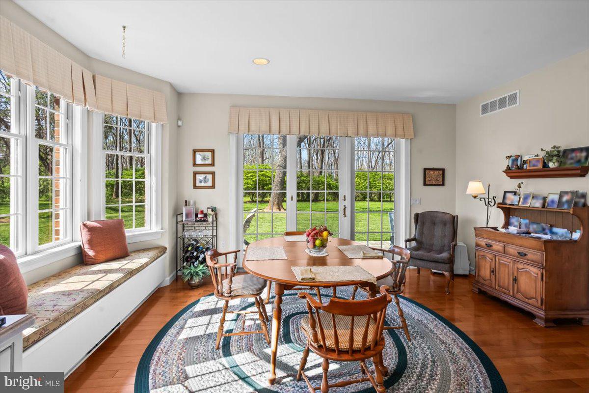 315 Rocherty Road Lebanon, PA 17042 - Photo 14 of 55 a dining room with furniture large windows and wooden floor