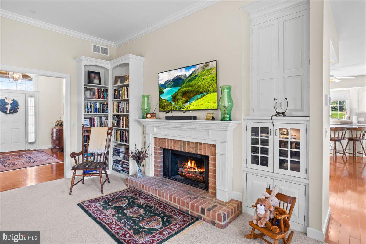 315 Rocherty Road Lebanon, PA 17042 - Photo 9 of 55 a living room with furniture a fireplace and a flat screen tv