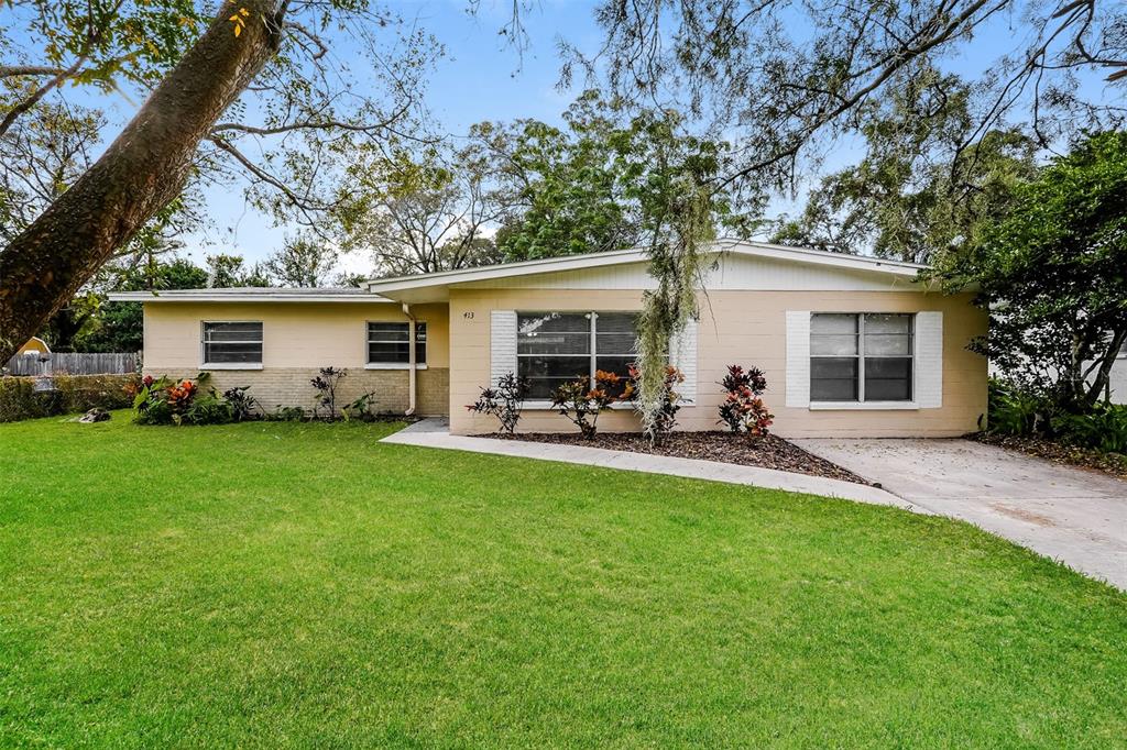 a view of a backyard with a patio