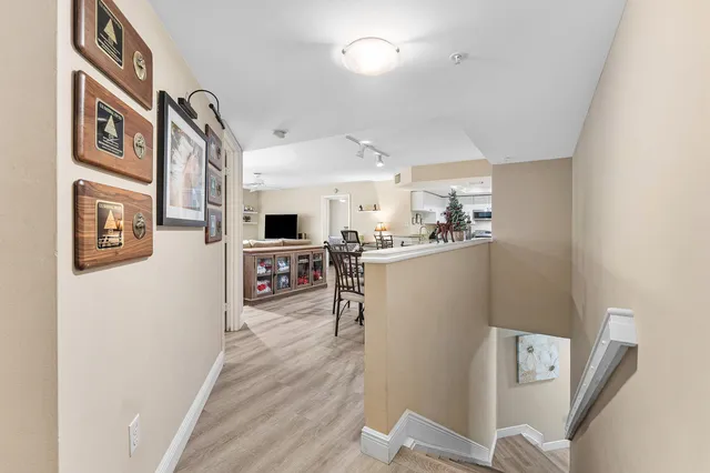 a kitchen with stainless steel appliances granite countertop a refrigerator and microwave