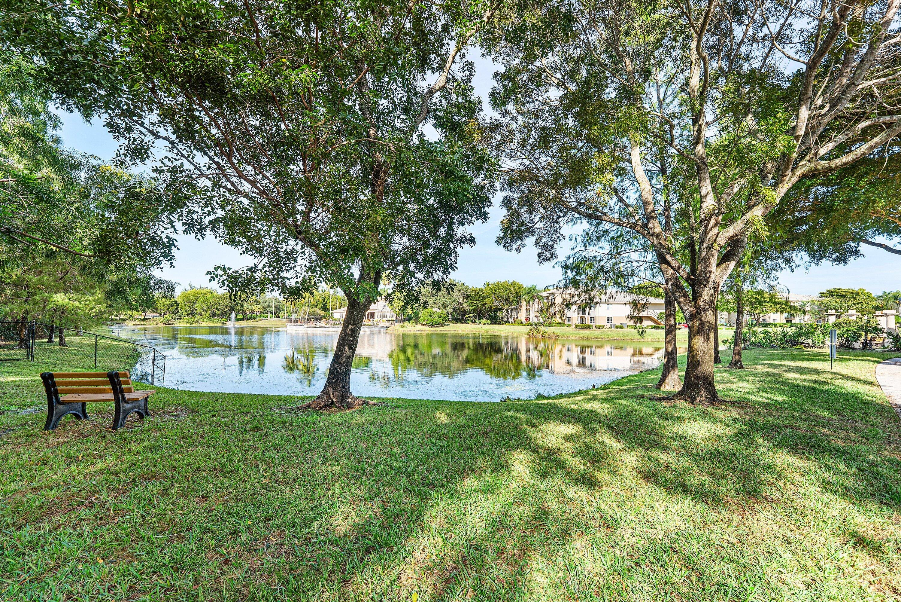 1000 Crestwood Court South, Unit 1015 Royal Palm Beach, FL 33411 - Photo 19 of 21 a view of a garden with trees