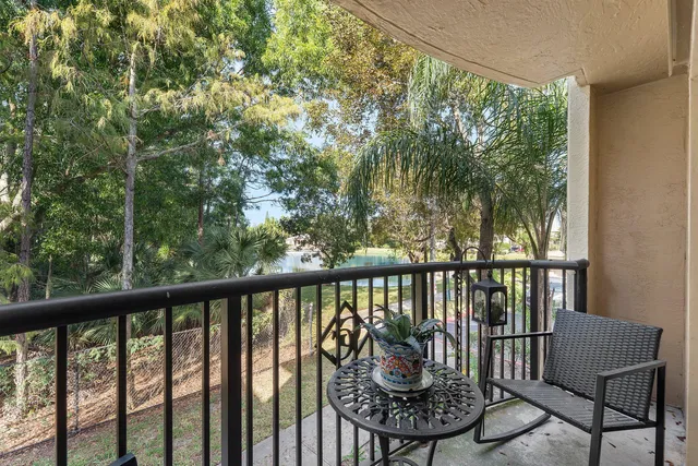 a view of a balcony with chairs