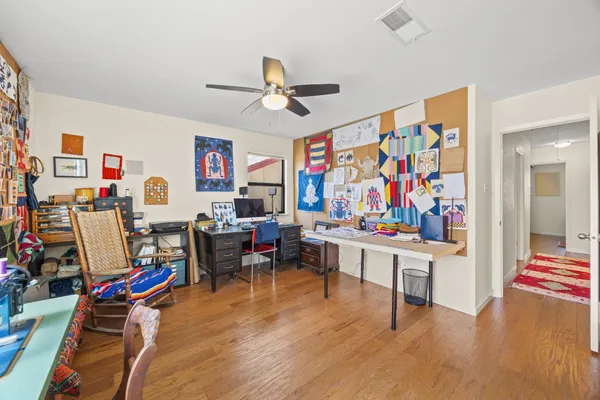 a view of a workspace with furniture and toys