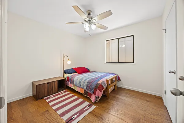 a bedroom with bed and window