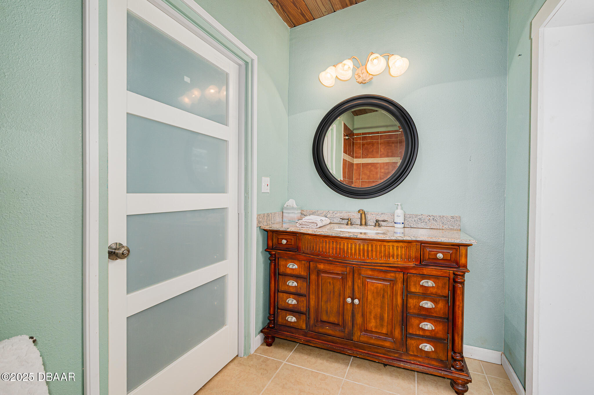 46 Oceanview Avenue Ponce Inlet, FL 32127 - Photo 38 of 79 a bathroom with a sink and a mirror