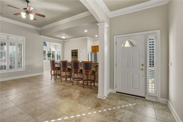 a view of a livingroom with furniture and a window
