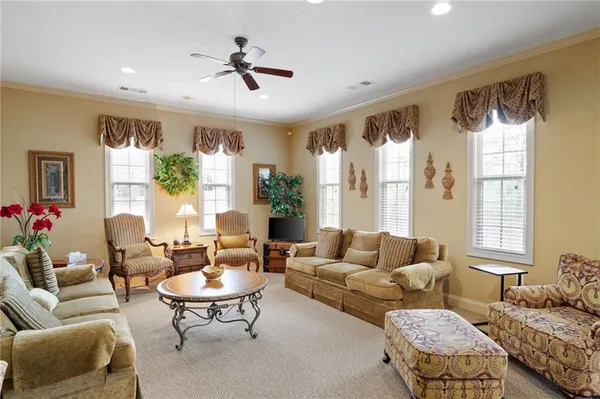 a view of a livingroom with furniture and windows