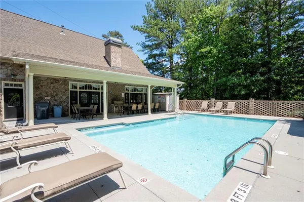 a view of a swimming pool with a patio