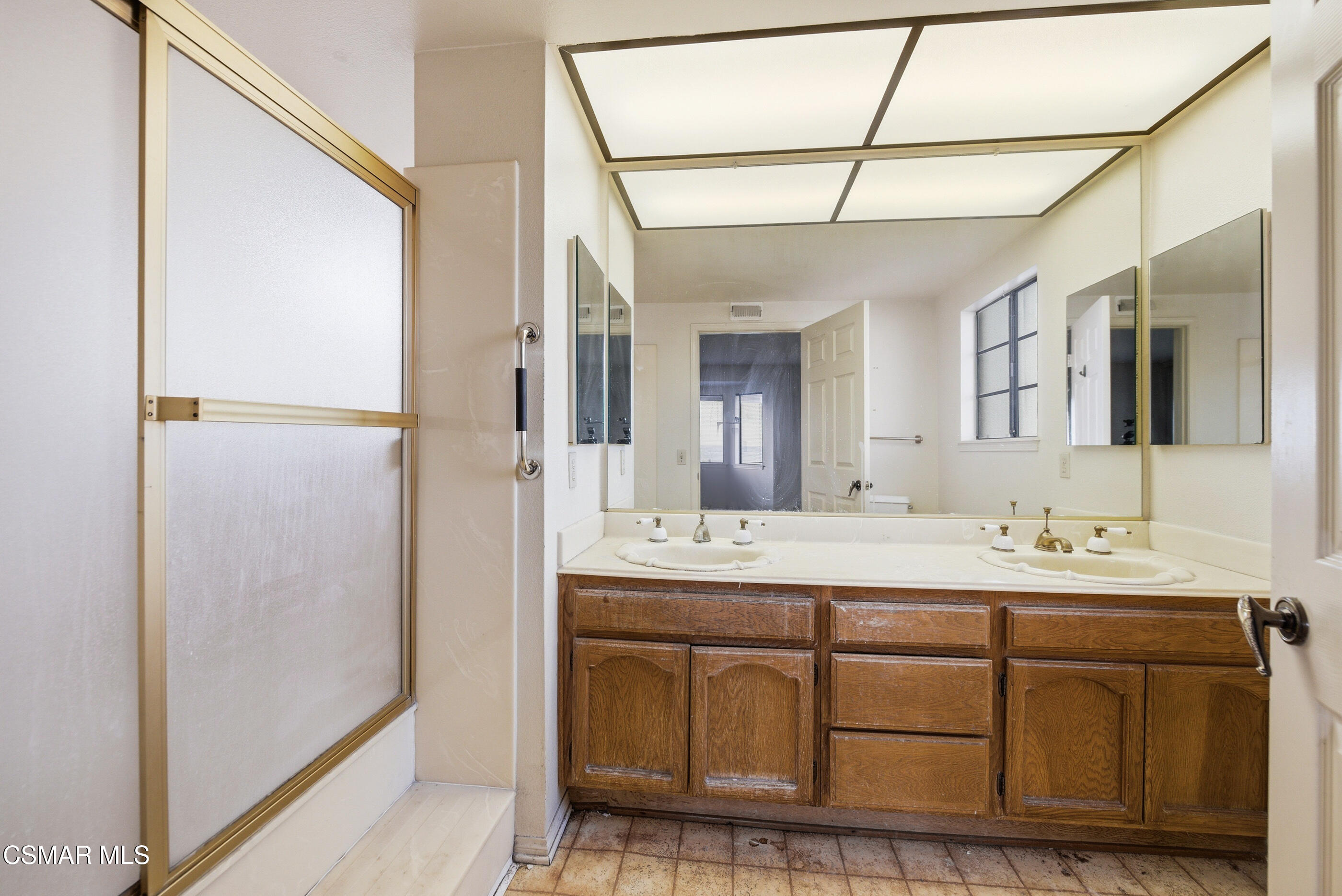 12036 Shadow Ridge Way Porter Ranch, CA 91326 - Photo 26 of 35 a bathroom with a double vanity sink and mirror