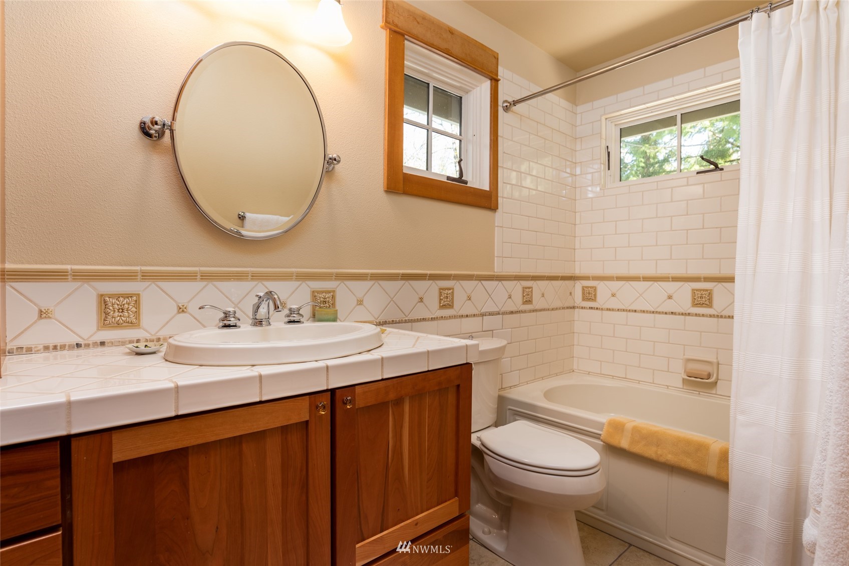 2133 Academy Road Bellingham, WA 98226 - Photo 29 of 40 a bathroom with a sink a toilet and a mirror