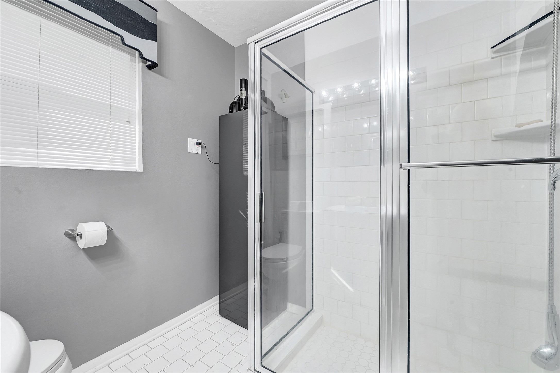 4831 Knickerbocker Street Houston, TX 77035 - Photo 36 of 50 Contemporary walk-in shower with glass enclosure and modern fixtures.