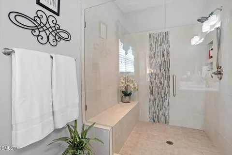 a bathroom with a bathtub and shower