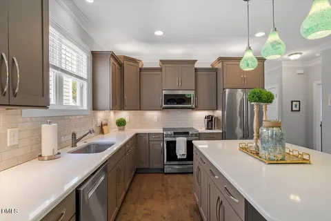 a kitchen with a sink and stove