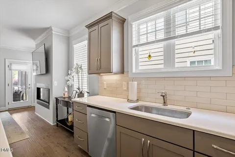 a kitchen with a sink and a window