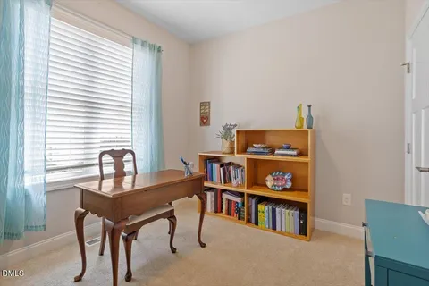 a work room with furniture and a window