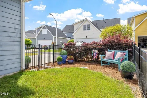 a view of a house with backyard and porch