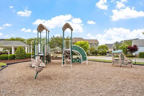 a view of a park with swings and slides