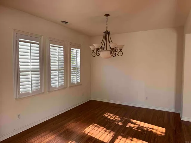 a kitchen with wooden floors and a sink