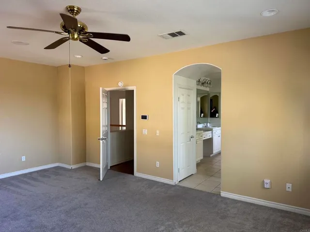 a room with a washing machine and a sink