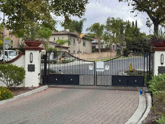 wooden floor fireplace and windows in an empty room