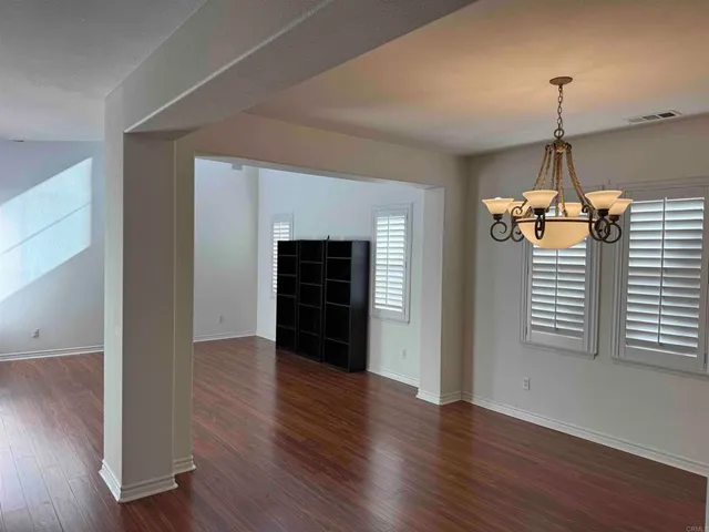 a kitchen with stainless steel appliances kitchen island granite countertop a stove a sink and a microwave