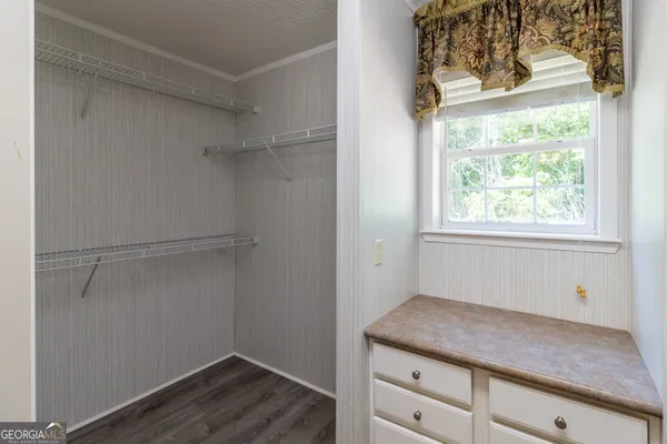 a room with a cabinets and a window
