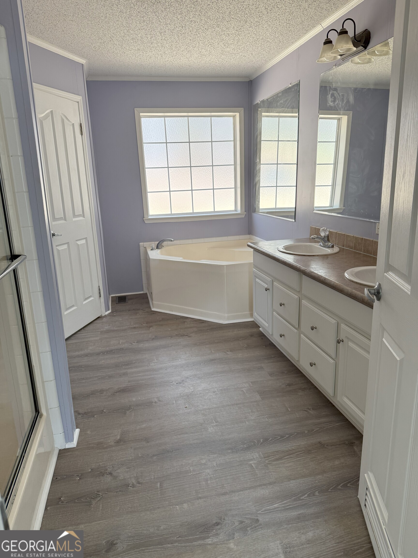 145 County Road Cedar Bluff, AL 35959 - Photo 20 of 21 a spacious bathroom with a granite countertop double vanity sink a mirror and a bathtub