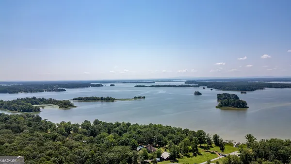 an aerial view of residential building and lake