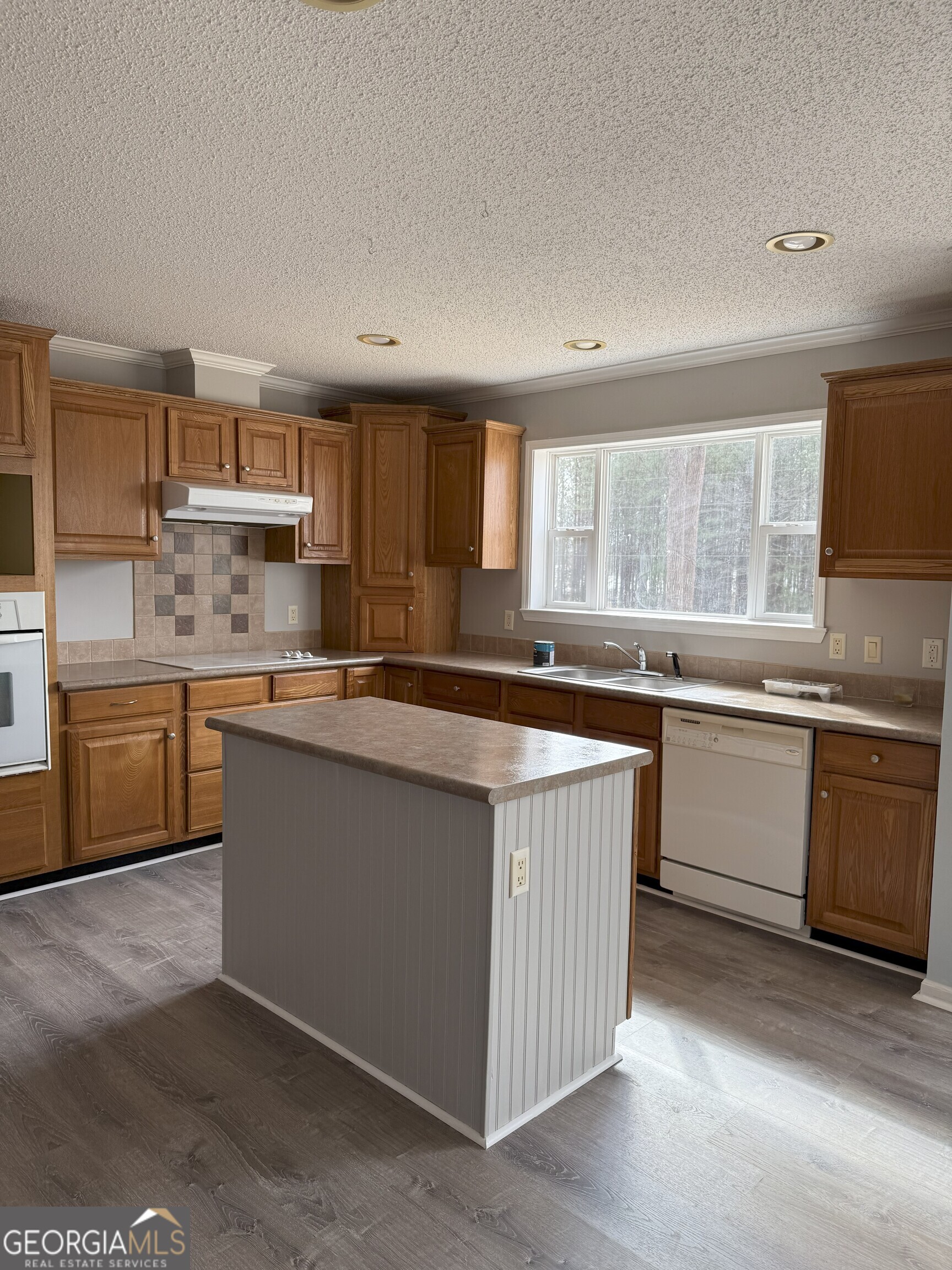 145 County Road Cedar Bluff, AL 35959 - Photo 8 of 21 a kitchen with a sink stove top oven and cabinets
