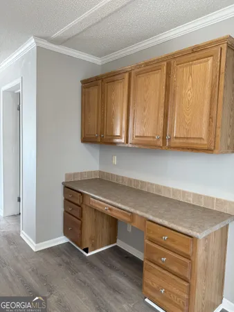 a view of cabinets with wooden floor