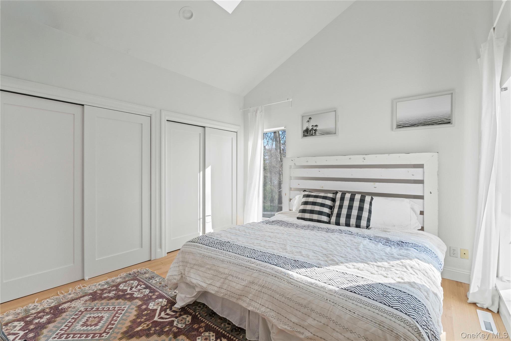 7 Midhampton Court Quogue, NY 11959 - Photo 15 of 24 a bedroom with a bed and a closet