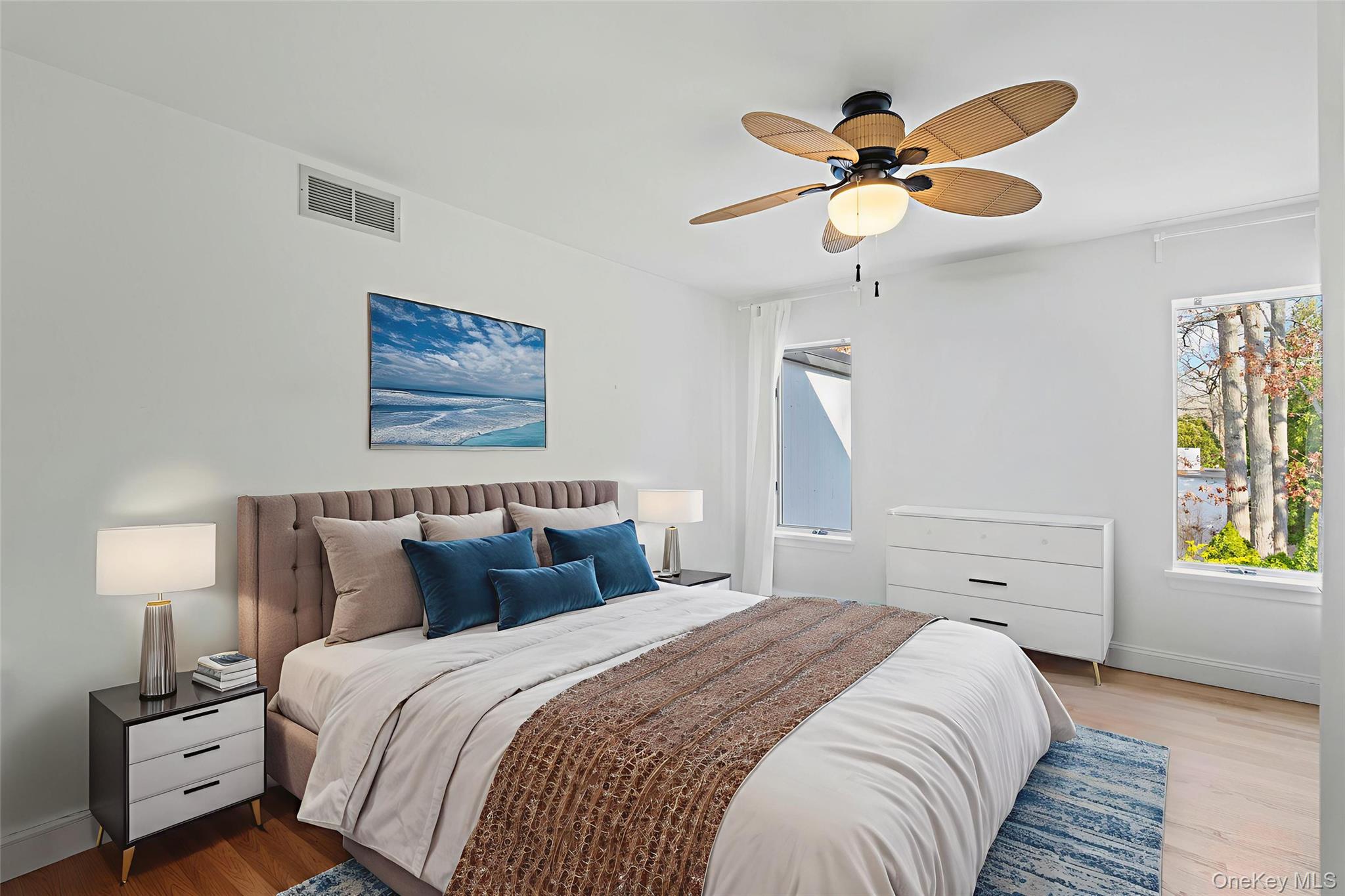 7 Midhampton Court Quogue, NY 11959 - Photo 17 of 24 a bedroom with a bed and a window