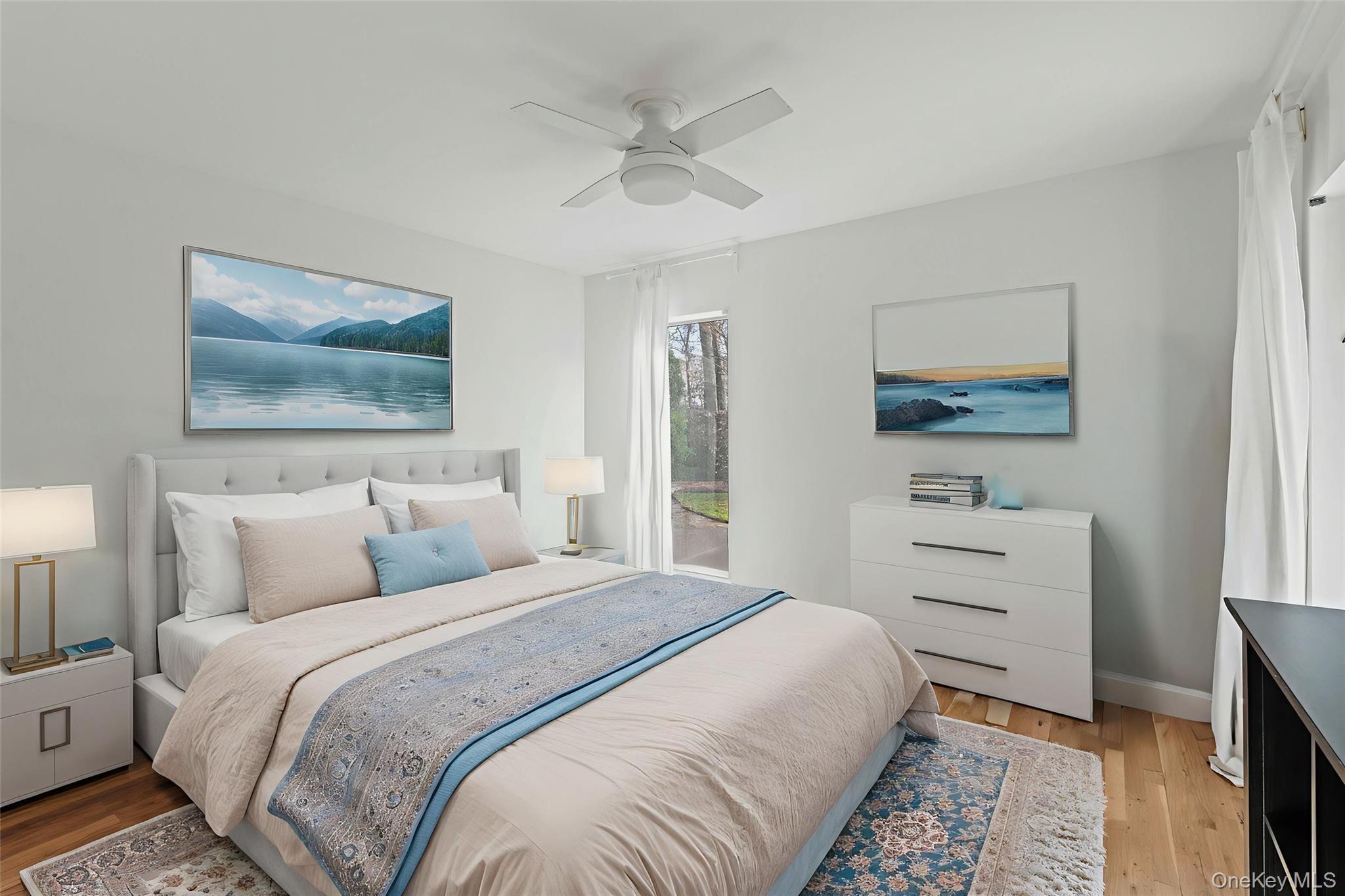 7 Midhampton Court Quogue, NY 11959 - Photo 19 of 24 a bedroom with a bed and a painting on the wall