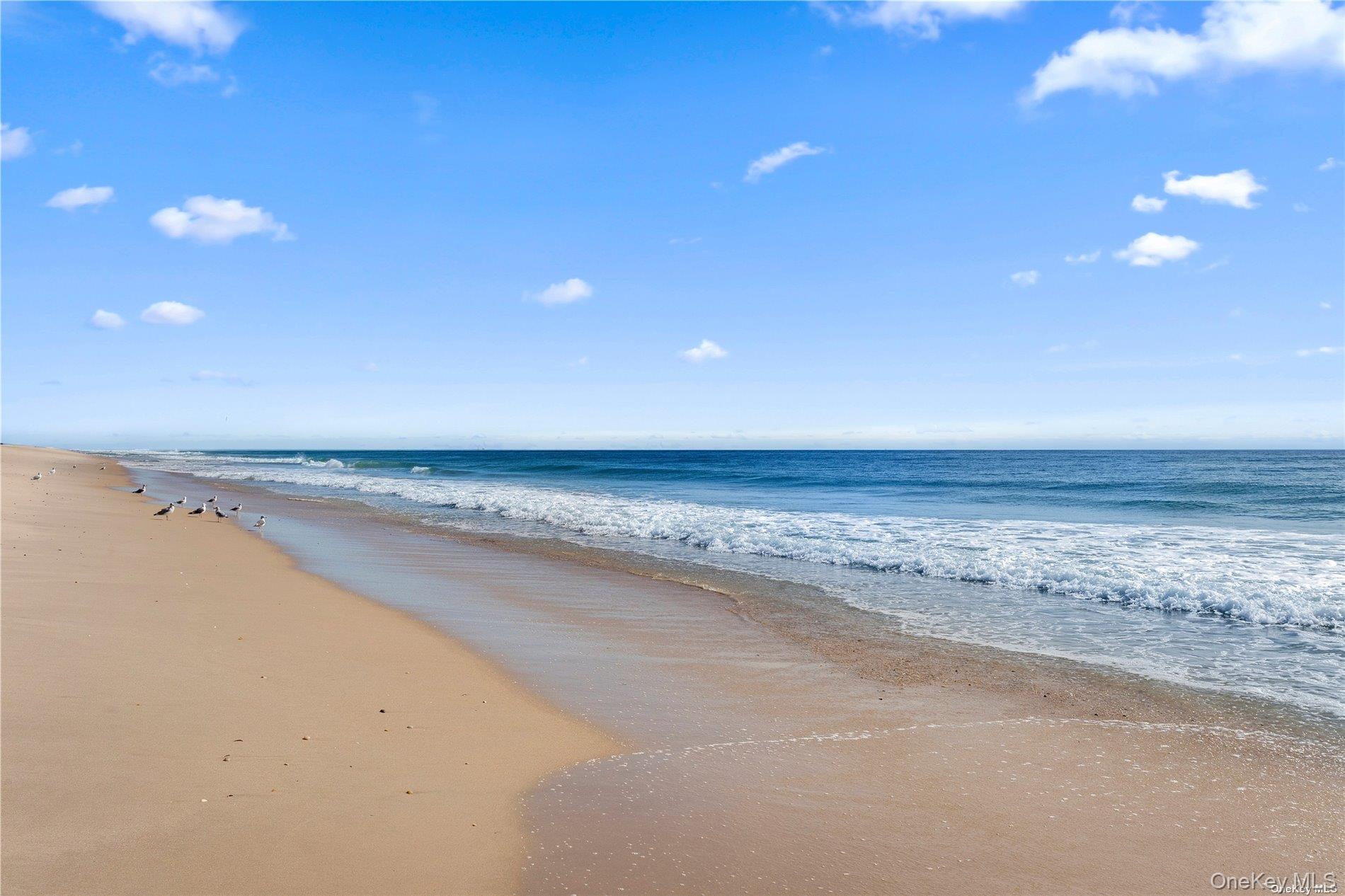 7 Midhampton Court Quogue, NY 11959 - Photo 27 of 29 a view of beach and ocean