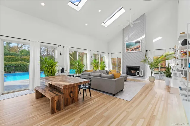 a living room with furniture fireplace and a table