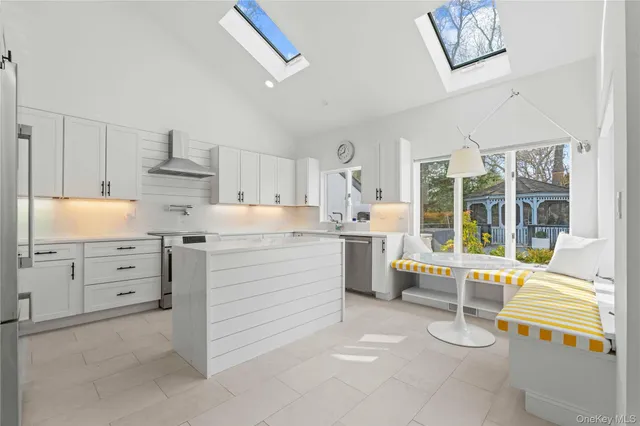 a kitchen with granite countertop cabinets and appliances