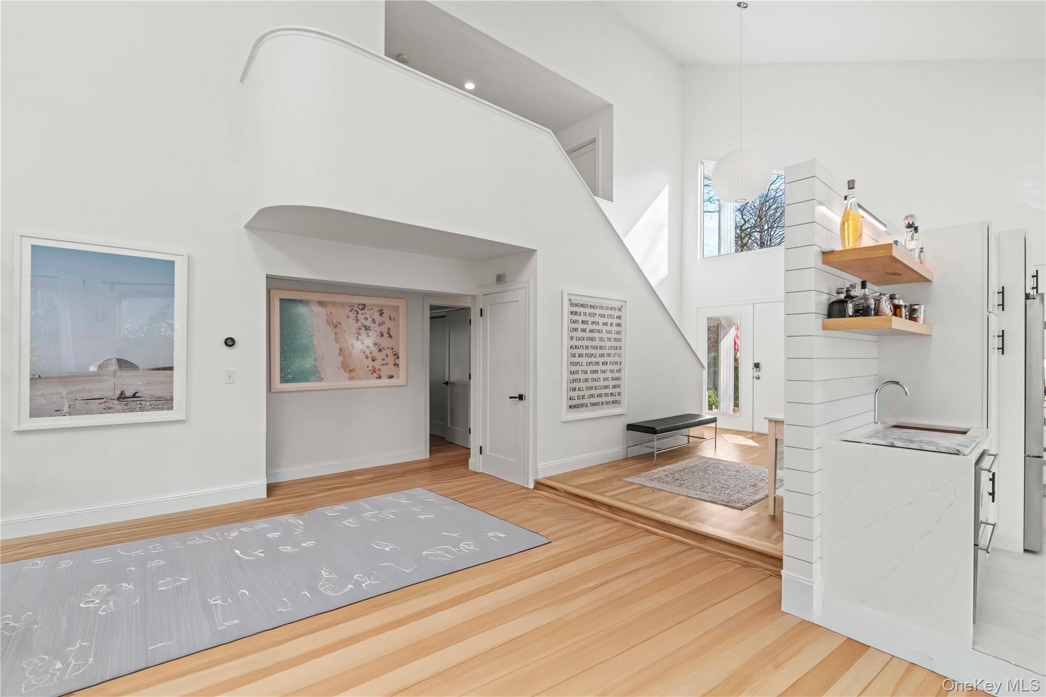 7 Midhampton Court Quogue, NY 11959 - Photo 7 of 29 a view of a hallway view with wooden floor and staircase