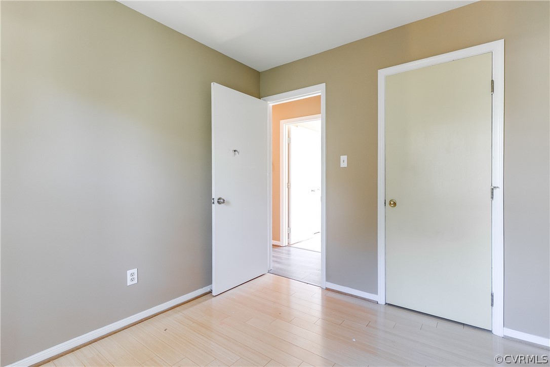 5212 South Jessup Road Chesterfield, VA 23832 - Photo 12 of 25 an empty room with wooden floor and windows