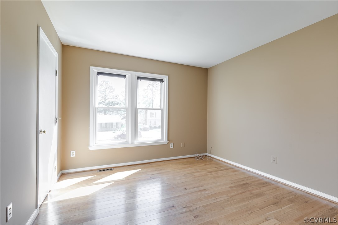 5212 South Jessup Road Chesterfield, VA 23832 - Photo 13 of 25 an empty room with wooden floor and windows