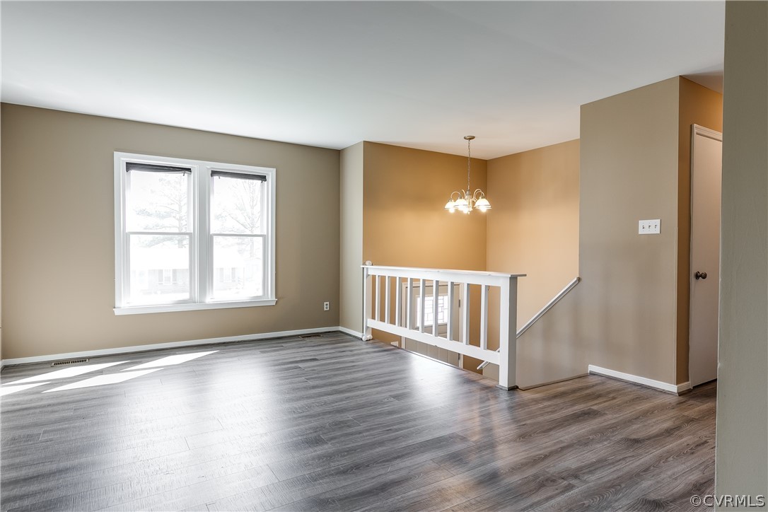5212 South Jessup Road Chesterfield, VA 23832 - Photo 4 of 25 a view of an empty room with wooden floor and a window